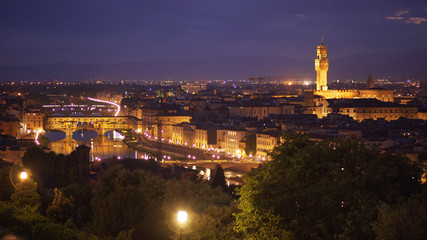 Fototapeta na wymiar In focus backdrop of Florence, Italy at night with bright city lights