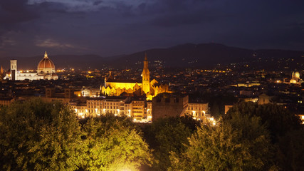 Fototapeta na wymiar Brightly lit city view of Florence Italy with landmarks in the distance