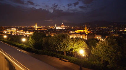 Beautiful city view of Florence, Italy at night with bright city lights