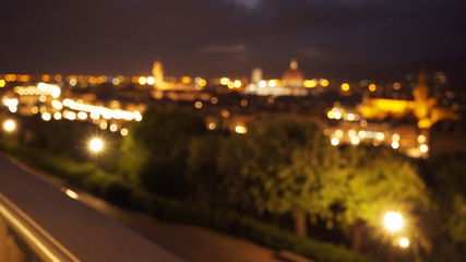Fototapeta na wymiar Blurred background plate of Florence, Italy cityscape at night for compositing