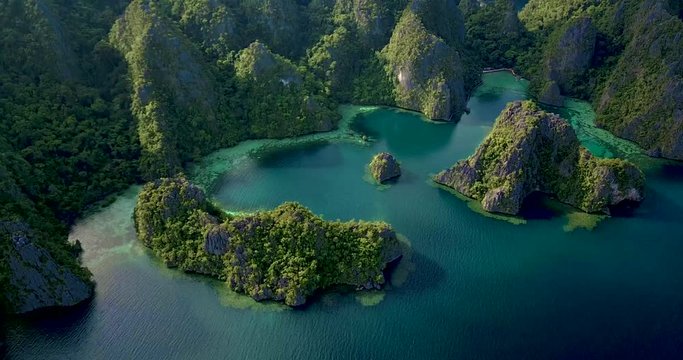 Aerial view of turquoise tropical lagoon with Karst limestone cliffs in Coron Island, Palawan, Philippines.