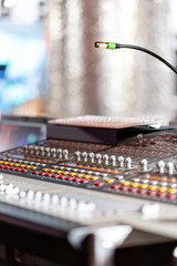 Mixing console of light equipment operator at the concert. Sound recording studio mixing desk with engineer or music producer