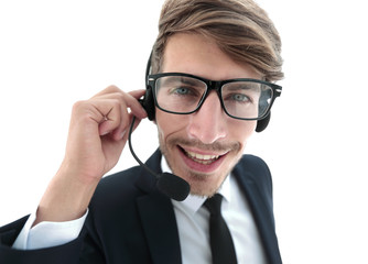 Smiling businessman talking on headset against a white backgroun