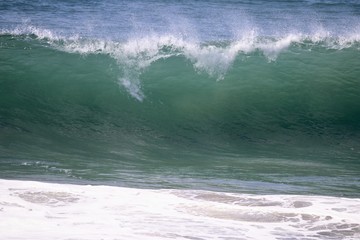 Large empty wave crashing in the ocean 
