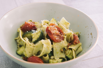 Flat noodles with vegetables in Pesto sauce