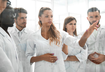 Fototapeta na wymiar closeup of a doctor-pharmacists and colleagues working in the la