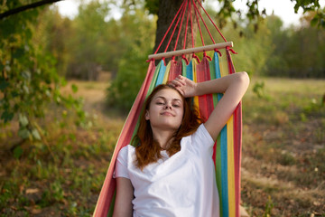 woman resting on a hammock in the country