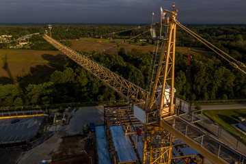 Aerial view of American construction building site with yellow crane