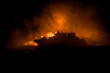 Sea battle scene. Silhouette of military war ship on dark foggy toned sky background. Explosion and fire. Dramatic scene decoration.