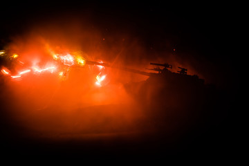 War Concept. Military silhouettes fighting scene on war fog sky background, World War German Tanks Silhouettes Below Cloudy Skyline At night. Attack scene. Armored vehicles. Tanks battle