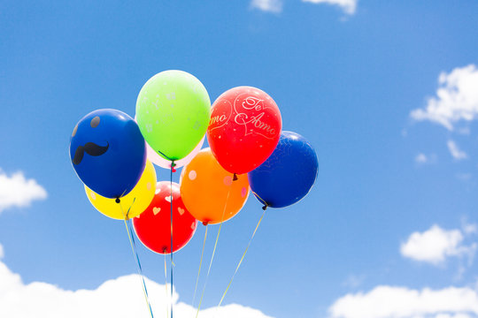 Multicolored balloons against the sky