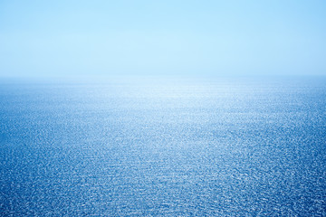 Fototapeta na wymiar Seascape with sea horizon and clear blue sky - Background