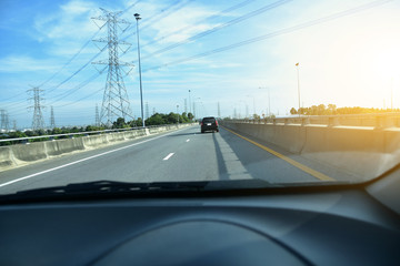 Car driving on highway  road against blue sky copy spec