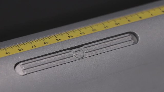 Industrial Big Printer, professional press, and paper supply. Robotized workflow, detailed shot of the pressure valve, next to a precise ruler. Engineering for plotting services.