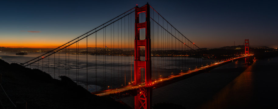 Golden Gate bridge in the early morning under its lights