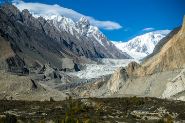 Fototapeta na wymiar Passu glacier surrounded by snow capped mountains in Karakoram range. Gojal valley. Gilgit Baltistan, Pakistan.