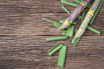 Close up sugarcane on wood background close up..