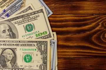 American dollars on wooden background. Top view, copy space