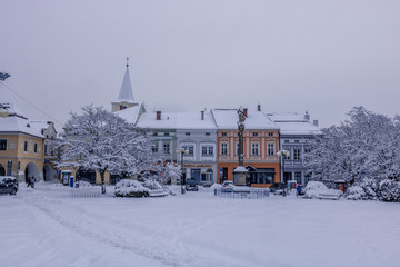 Square during first winter snow in Czech city Valasske Mezirici