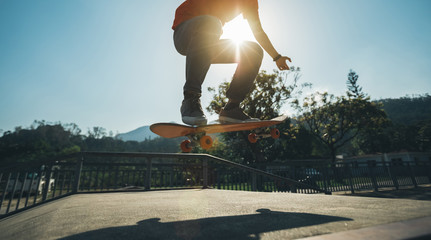 Skateboarder skateboarding at skatepark © lzf