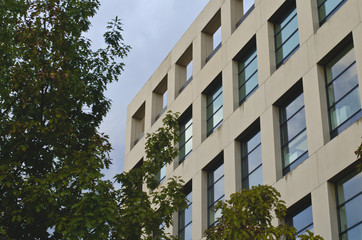 The front of the square building front of the downtown library. 