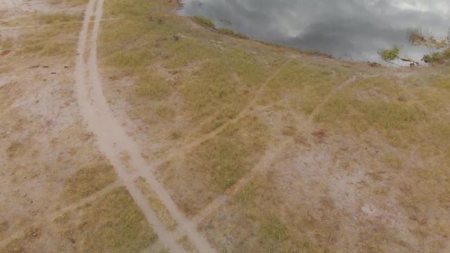 4K aerial chase of a troop of baboons at the kwando river