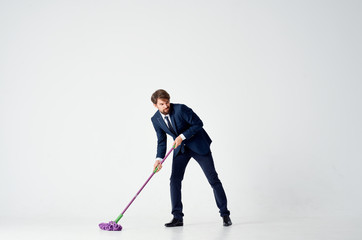 angry business man mopping floors on isolated background
