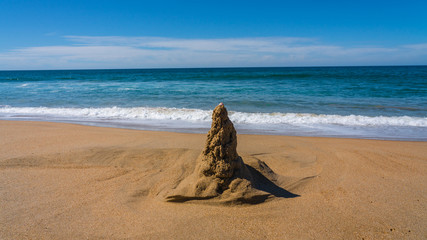 sand castle awaiting rising tide