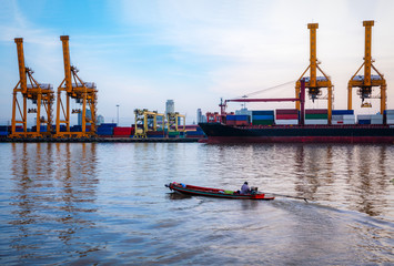 Container Cargo ship and cargo plane with working crane bridge in shipyard during sunrise,logistic...