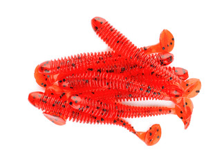Rubber worms on white background, top view. Fishing lure