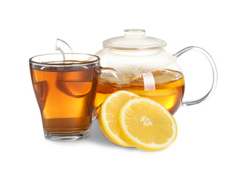 Cup and teapot with lemon tea on white background