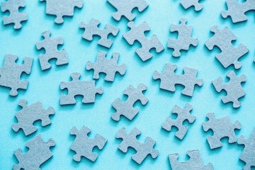 Puzzle pieces on blue background 