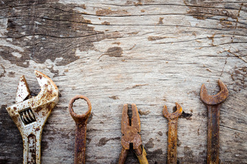 Old rusty tools on wooden background. vintage styles - Powered by Adobe