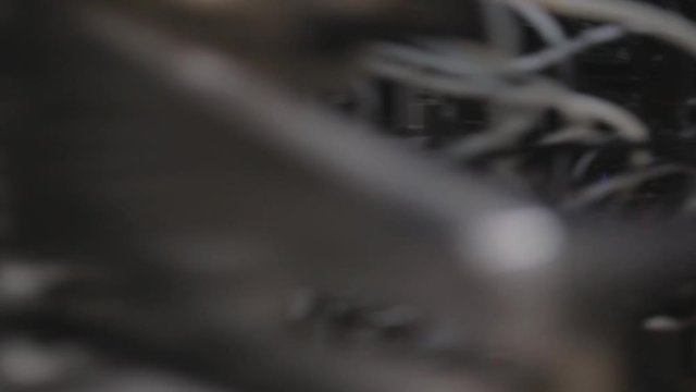 Industrial Big Printer, professional press, and paper supply. Robotized workflow, detailed shot of the passing print head, while processing large, vinyl, glossy, rolls. Color samples before final ok.