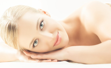 Fototapeta premium Spa portrait of young, healthy and beautiful woman isolated on white.