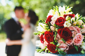 wedding bouquet in front of the newlyweds