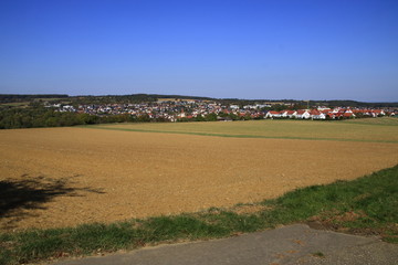 Fototapeta na wymiar Blick über das Heckengäu auf die Gemeinde Weissach im Landkreis Böblingen