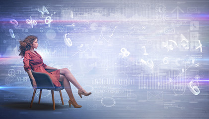 Elegant woman sitting in a sofa with numbers and reports concept

