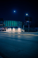 Gritty dark Chicago train bridge underpass with traffic at night