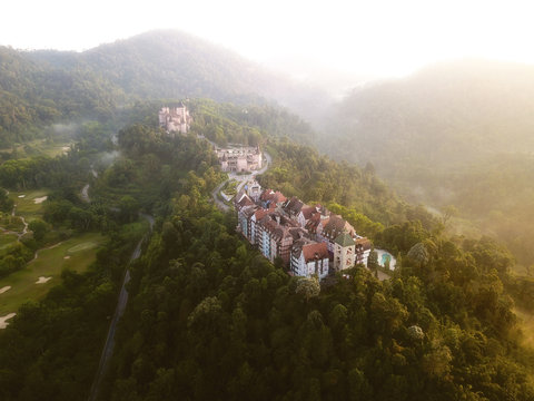 Aerial view of french style building at Bukit Tinggi with dramatic fog and sunrise.