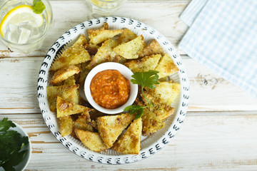Baked potato with roasted pepper dip