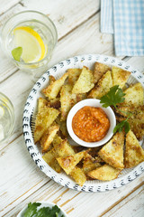 Baked potato with roasted pepper dip