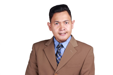 Cynical Asian businessman looking to camera with anger