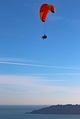 Tandem paraglider above Start Bay