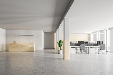 Wooden office reception desk and open space, front