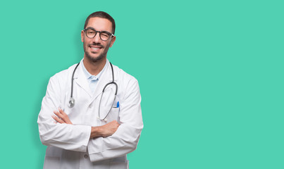 Happy young doctor winking an eye