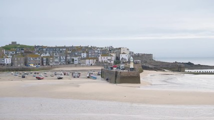 St Ives beach and harbour very early in the morning before sunrise.