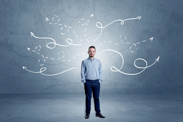 Elegant businessman choosing between directions with winding drawn arrows around 
