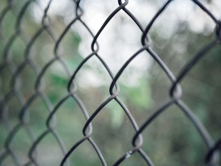 Polonne / Ukraine - 28 September 2018: chain fence on a blurry background