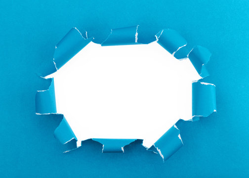 Blue ripped open paper background,space for your message on torn paper.